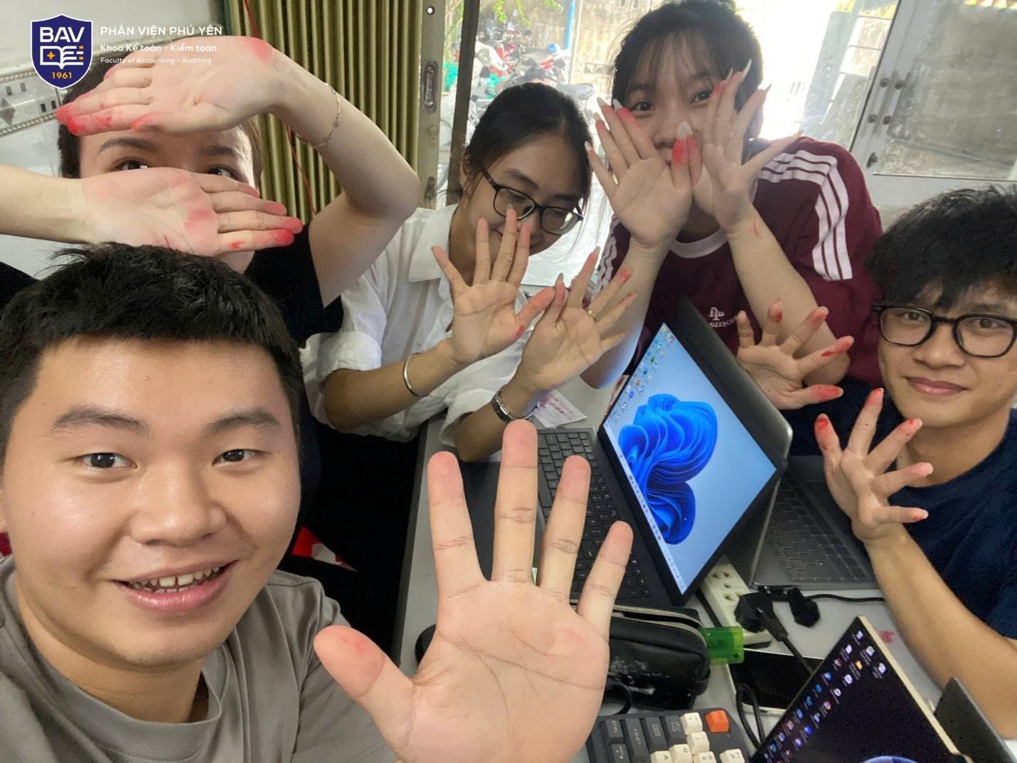 ''A group of people with their hands up

Description automatically generated''